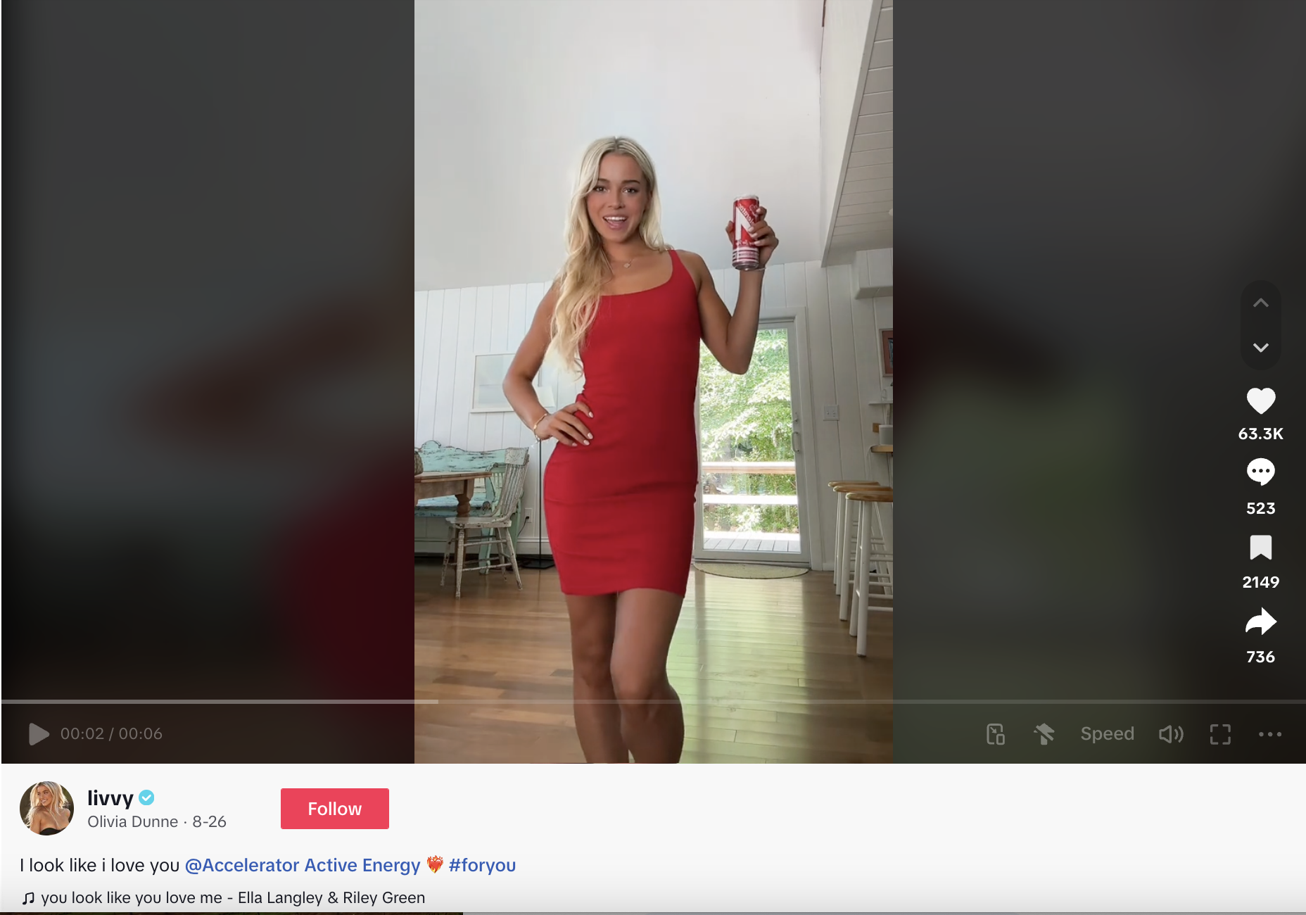 A TikTok video of gymnast Olivia Dunne holding an Accelerator energy drink while lip syncing to a trending sound 